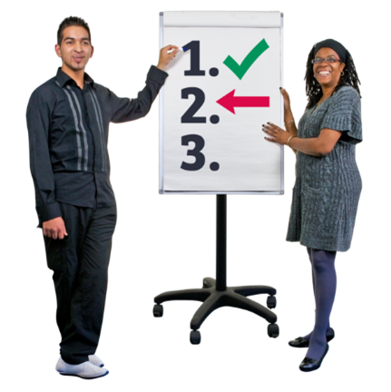 Two people standing with a board